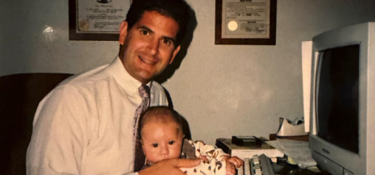 Roger Acosta with his son RJ at Cannon & Acosta, LLP’s first 900 square foot office in Huntington Station.  